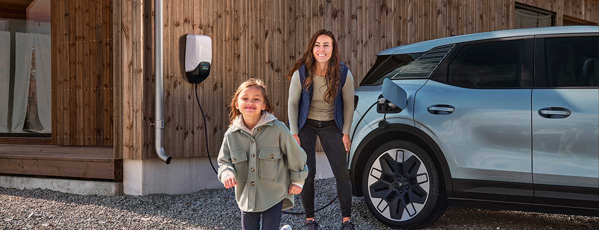 A family charging their car