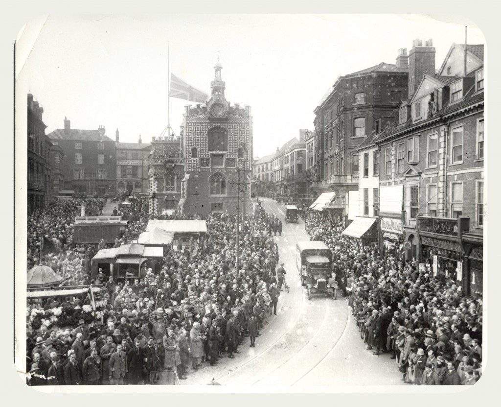 Vehicles driving through Norwich City Centre on Armistace Day, 1926.