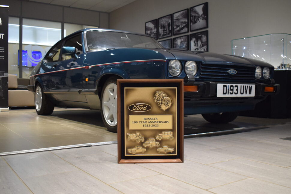 Busseys 100 Year Plaque with a Ford Capri in the Busseys FordStore